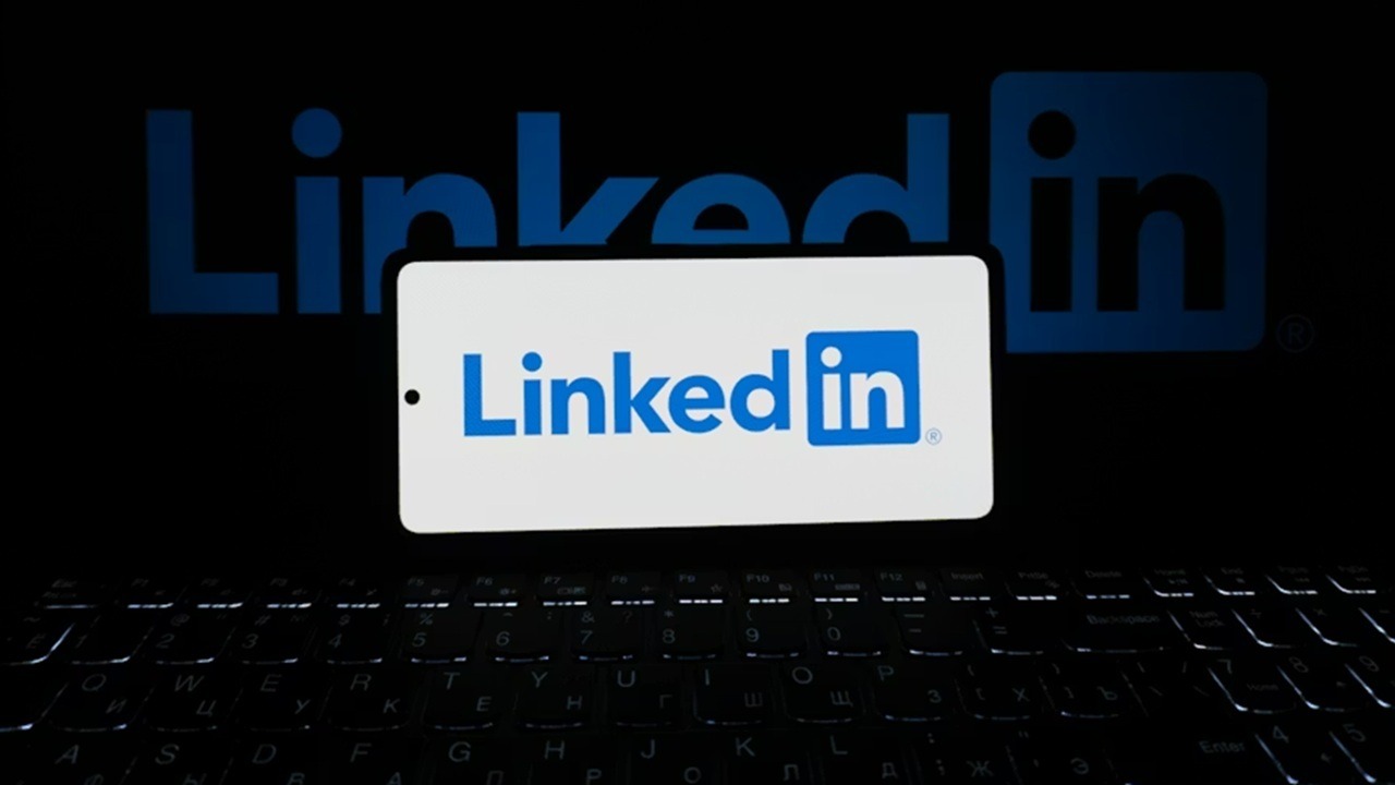Linkedin a laptop and a phone.